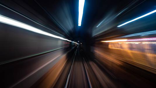 A photo of lights as if you were in a high speed tunnel