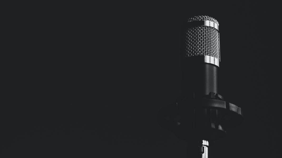 A photo of a microphone with a retro-style and a faded background